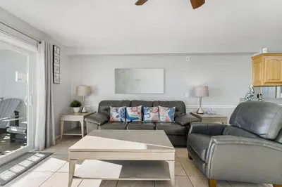 a living room with a couch and a table at The Summit 1032 in Panama City Beach