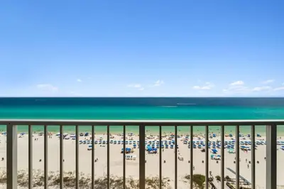 a view of the beach from the balcony of a condo at The Summit 1222 in Panama City Beach