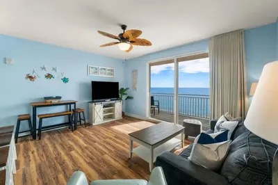 a living room with a couch and a television at Splash 804E in Panama City Beach