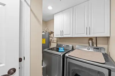 a kitchen with a stove and a refrigerator at Treasure Island #1203 by Book That Condo in Panama City Beach