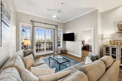 a living room with a couch and a tv at Villages of South Walton B324 by 30A Escapes in Rosemary Beach
