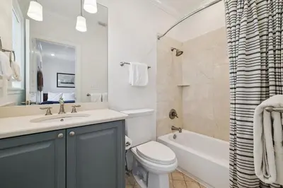 a bathroom with a sink and a toilet and a tub at Always On My Mind by 30A Escapes in Seacrest