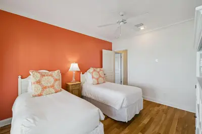 two beds in a room with orange walls at Always On My Mind by 30A Escapes in Seacrest