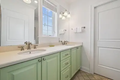 a bathroom with a sink and a mirror at Always On My Mind by 30A Escapes in Seacrest