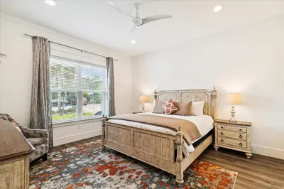 a bedroom with a large bed and a window at Family Tradition by 30A Escapes in Seacrest