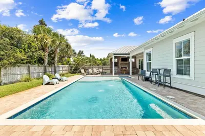 a swimming pool in the backyard of a house at Family Tradition by 30A Escapes in Seacrest