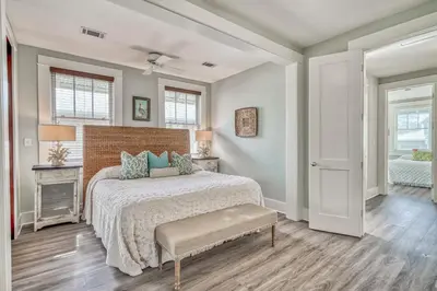 a bedroom with a large bed and a window at Sandy Haven by 30A Escapes in Rosemary Beach