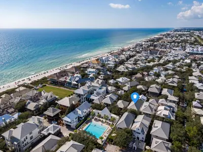 an aerial view of a beach with houses and the ocean at Sandy Haven by 30A Escapes in Rosemary Beach