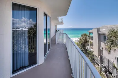 a balcony with a view of the beach and the ocean at HP 36W Condo by 30A Escapes in Rosemary Beach