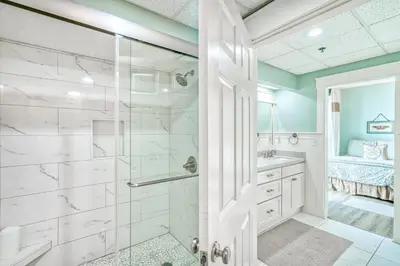 a bathroom with a shower and a sink at HP 36W Condo by 30A Escapes in Rosemary Beach