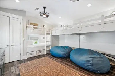 a room with two blue bean bags on the floor at At Ease by 30A Escapes in Rosemary Beach