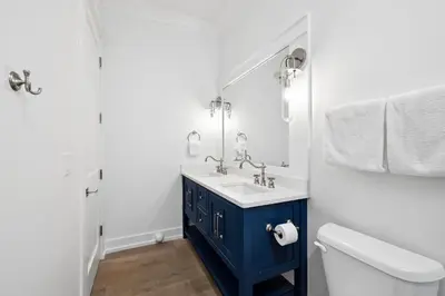 a bathroom with a blue sink and a toilet at Sea Castle by 30A Escapes in Sunnyside