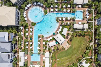 an overhead view of a pool at a resort at Walkin on Sunshine by 30A Escapes in Rosemary Beach
