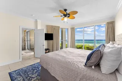 a bedroom with a bed and a large window at HP 15E Gulf Front Condo by 30A Escapes in Rosemary Beach