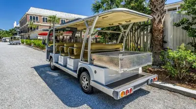 a golf cart with seats on a street at Happy Place by 30A Escapes in Rosemary Beach