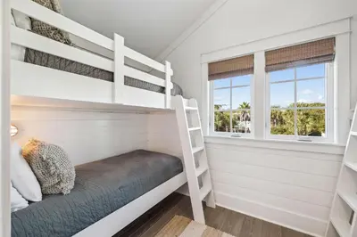 a bedroom with bunk beds and a window at Tidey Whitey by 30A Escapes in Seacrest