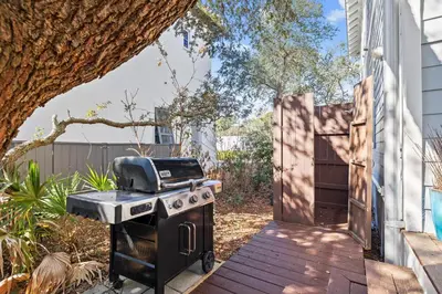 a barbecue grill with a toaster on a patio at Sand Pointe by 30A Escapes in Inlet Beach