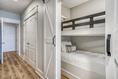 a bedroom with two bunk beds and a closet at Poolside Paradise by 30A Escapes in Rosemary Beach