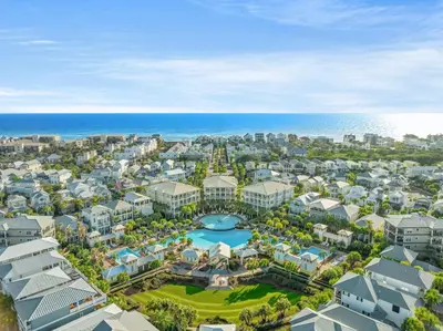 an aerial view of a resort with a pool and the ocean at Endless Summer Escape by 30A Escapes in Rosemary Beach