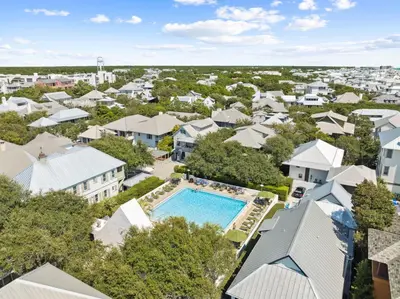 an aerial view of a residential neighborhood with a pool and houses at Tuscan Blue by 30A Escapes in Rosemary Beach