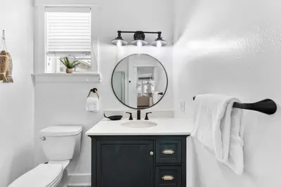 a bathroom with a sink and a mirror at Hidden Gem #6 by 30A Escapes in Seacrest