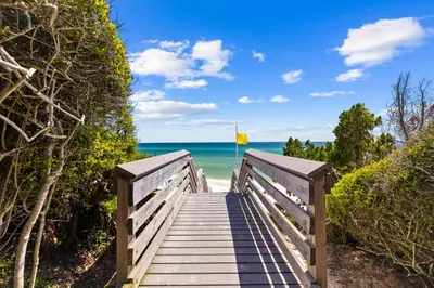 a wooden boardwalk leading to the beach at Hidden Gem #6 by 30A Escapes in Seacrest