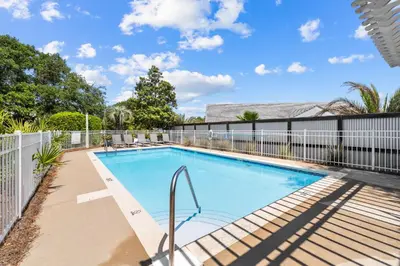 a swimming pool in the backyard of a house at Hidden Gem #6 by 30A Escapes in Seacrest
