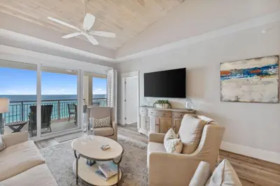 a living room with a couch and a tv at HP 45W What the Heck by 30A Escapes in Rosemary Beach