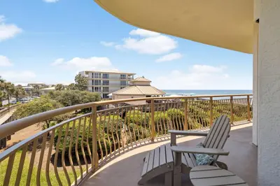 a balcony with a chair and a view of the ocean at HP 21W Gulf Front Condo by 30A Escapes in Rosemary Beach