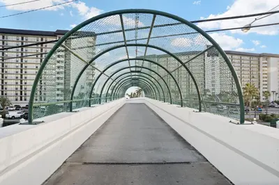 a bridge over a street in a city at Edgewater Golf Villas #1714 by InJoy Vacations in Panama City Beach
