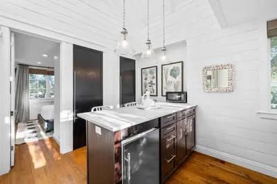 a kitchen with a sink and a counter top at 103 E Kingston by 30A Escapes in Rosemary Beach