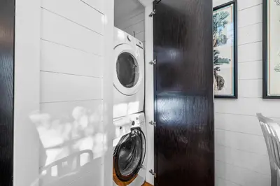 a laundry room with a washer and dryer at 103 E Kingston by 30A Escapes in Rosemary Beach