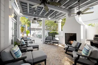 a living room with couches and a fireplace at 103 E Kingston by 30A Escapes in Rosemary Beach