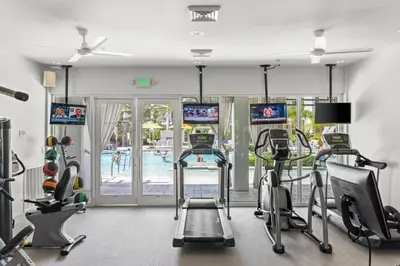 a gym with cardio equipment and a swimming pool at The Pointe Unit 321 by 30A Escapes in Rosemary Beach