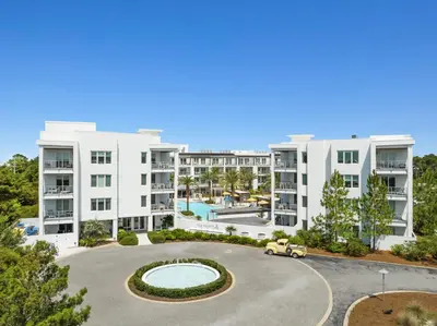an aerial view of an apartment complex with a parking lot at The Pointe Unit 321 by 30A Escapes in Rosemary Beach