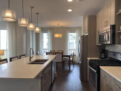 a kitchen with a sink and a stove top oven at The Pointe Unit 321 by 30A Escapes in Rosemary Beach