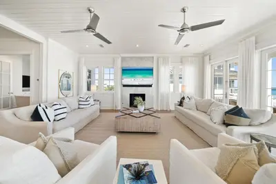 a living room with white furniture and a fireplace at The Odessa by 30A Escapes in Seagrove Beach