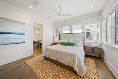 a bedroom with a bed and a painting on the wall at The Odessa by 30A Escapes in Seagrove Beach