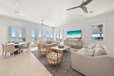 a living room with a couch and a table at The Odessa by 30A Escapes in Seagrove Beach
