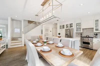 a kitchen and dining room with a table and chairs at Casablanca by 30A Escapes in Rosemary Beach