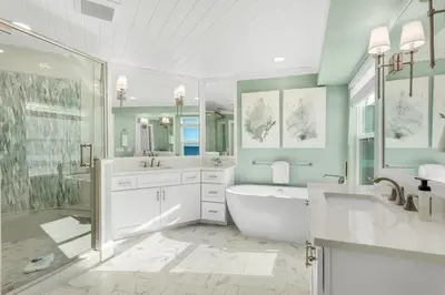 a bathroom with a tub and a sink and a shower at Searenity Now by 30A Escapes in Seagrove Beach