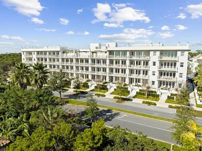 an aerial view of a large white building at Kaiya Beach Resort in Inlet Beach
