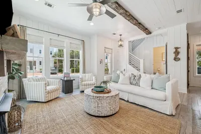 a living room with a white couch and chairs at Dune Our Thing by 30A Escapes in Inlet Beach
