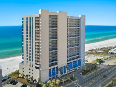 an aerial view of a building next to the beach at Palazzo Unit 301 by 30A Escapes in Panama City Beach