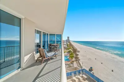 a balcony with a view of the beach and the ocean at Palazzo Unit 301 by 30A Escapes in Panama City Beach