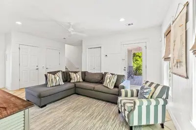 a living room with a couch and two chairs at Barefoot Too by 30A Escapes in Inlet Beach