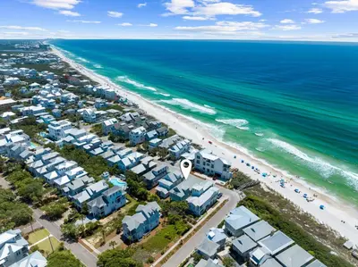 an aerial view of a beach with houses and the ocean at Barefoot Too by 30A Escapes in Inlet Beach