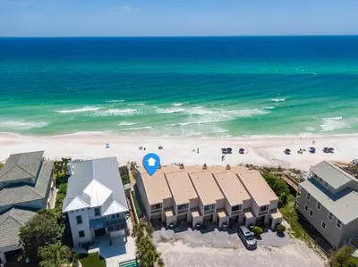 an aerial view of a beach with buildings and people at Mermaid Cove by 30A Escapes in Seacrest