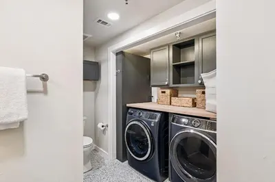 a laundry room with a washer and dryer at Tranquillity on 30A Unit# 210 by 30A Escapes in Seacrest