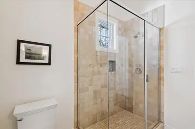 a shower with a glass door in a bathroom at Casita By The Sea by 30A Escapes in Rosemary Beach